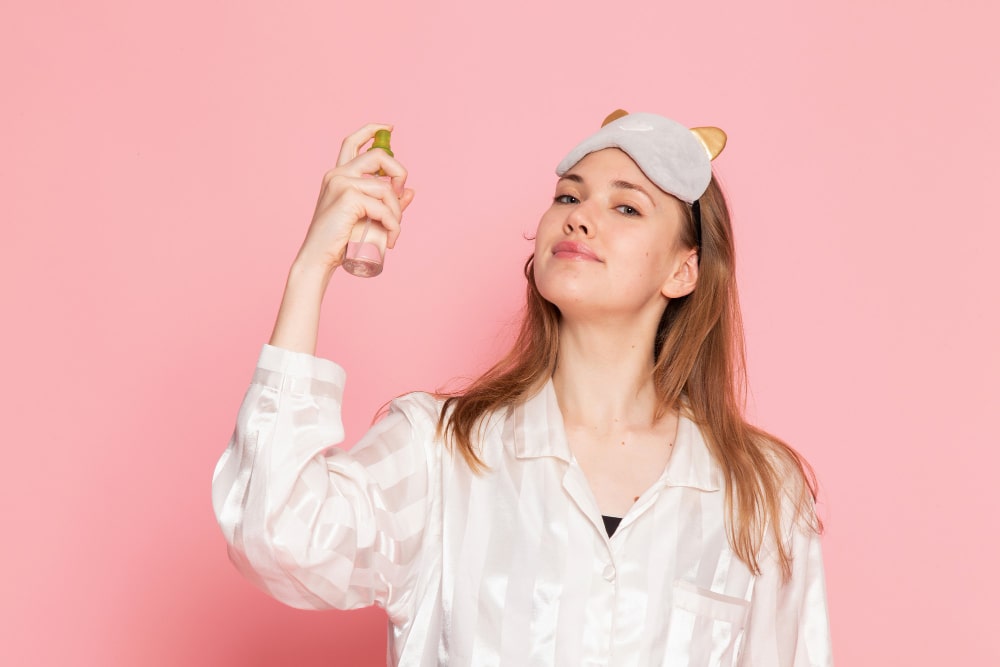 A facial mist bottle being sprayed and a clear face in 2 days.