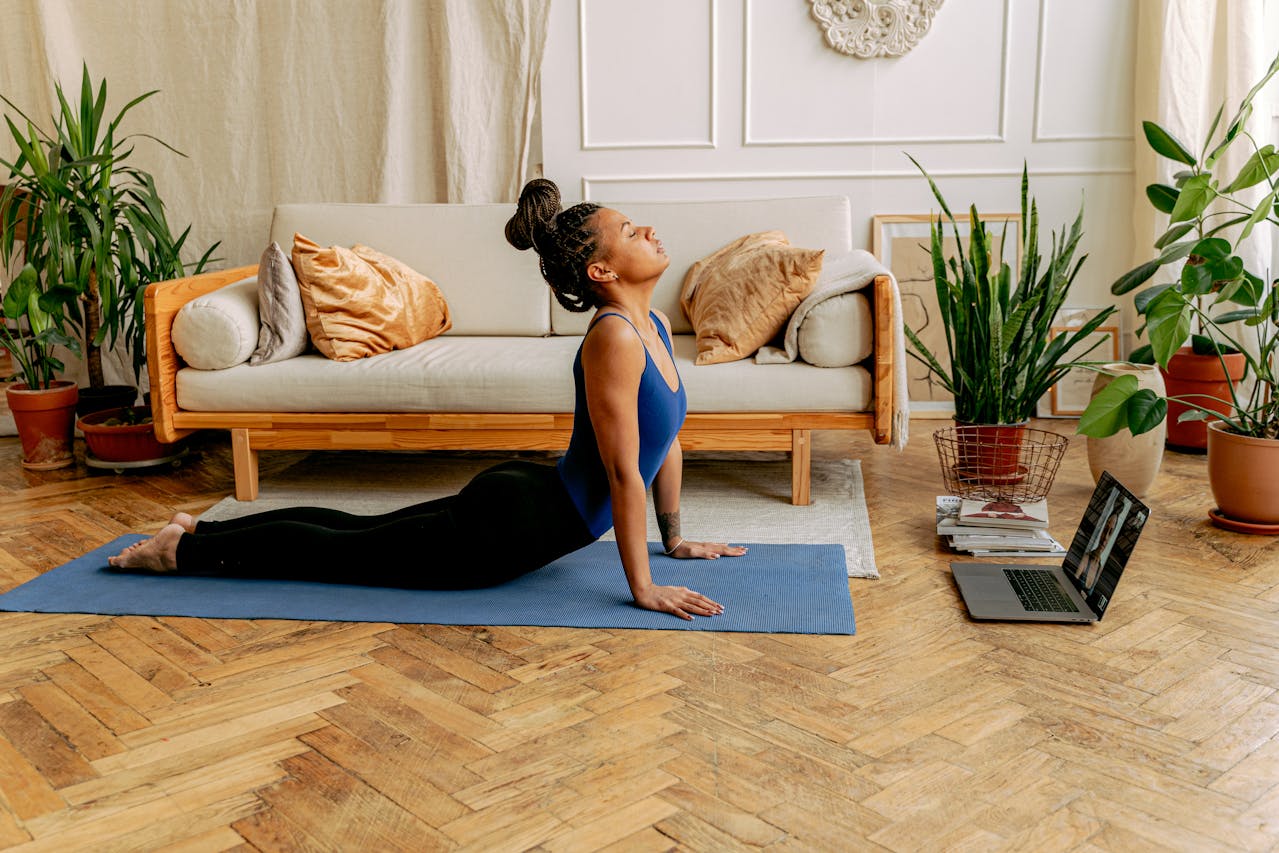 Following a guided workout video on a tablet for at-home fitness