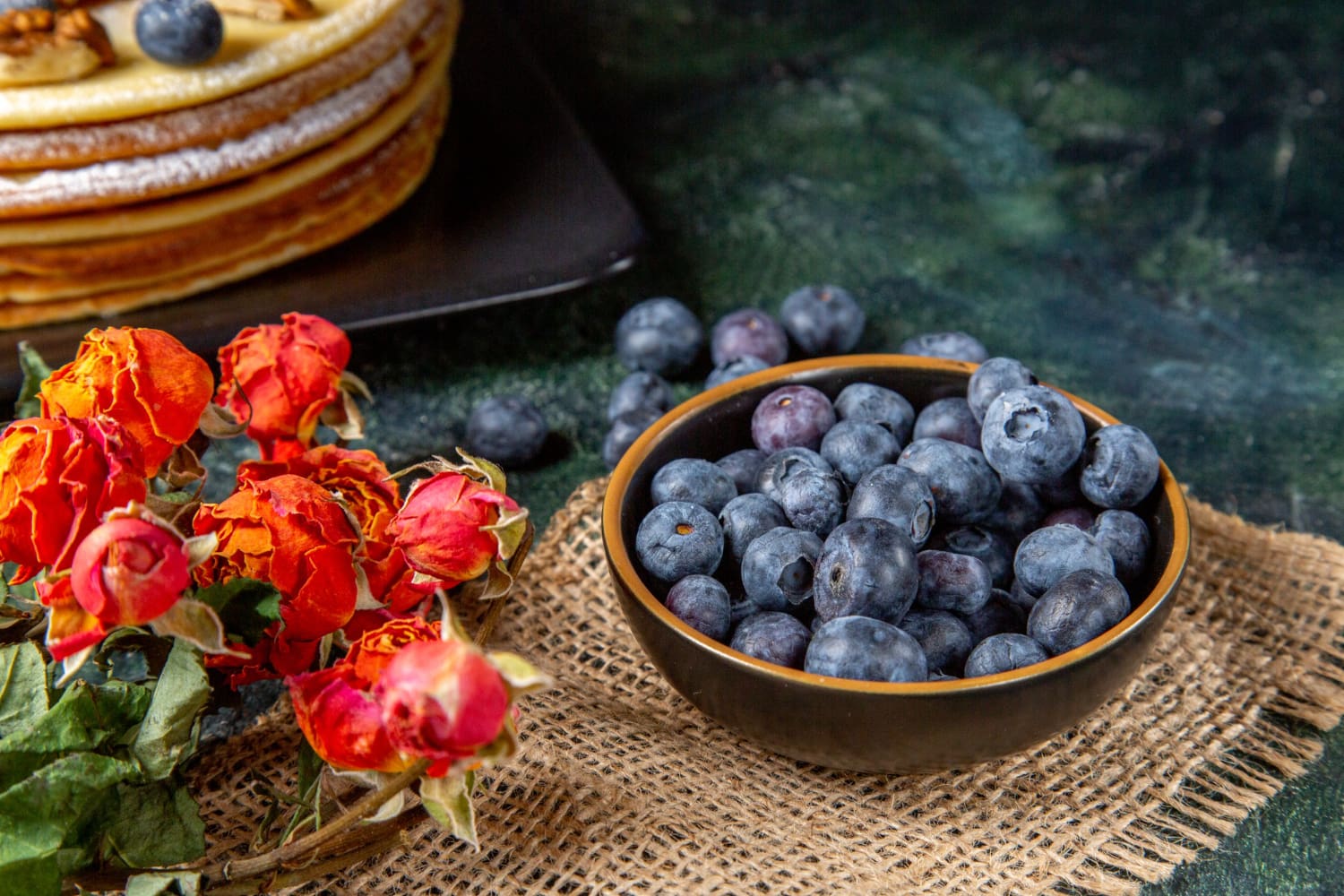 Fresh blueberries in a bowl, highlighting their deep blue color.