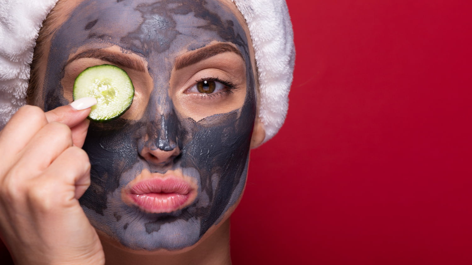 Charcoal and aloe vera detox mask applied on a person’s face